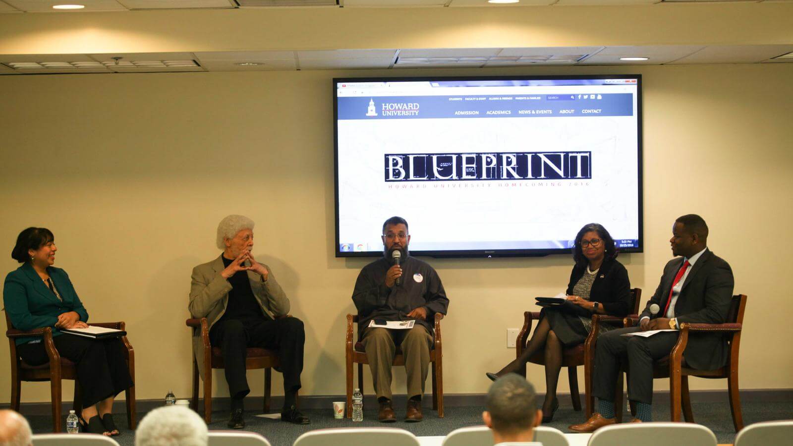 Ron Dellums on stage during lecture