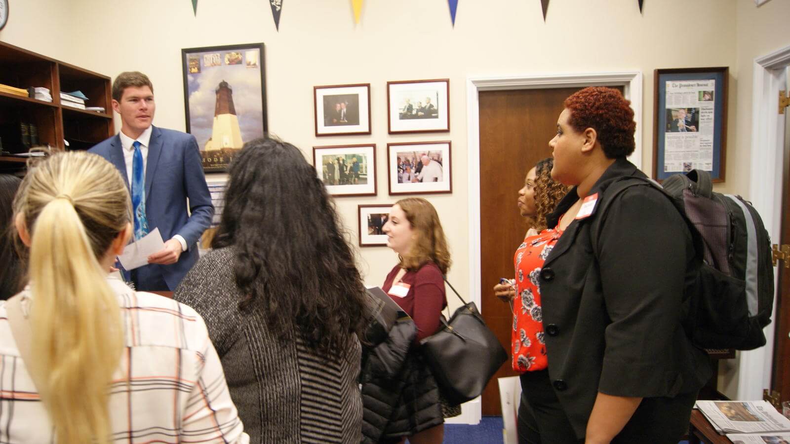 Social work students inside of office talking with policy makers