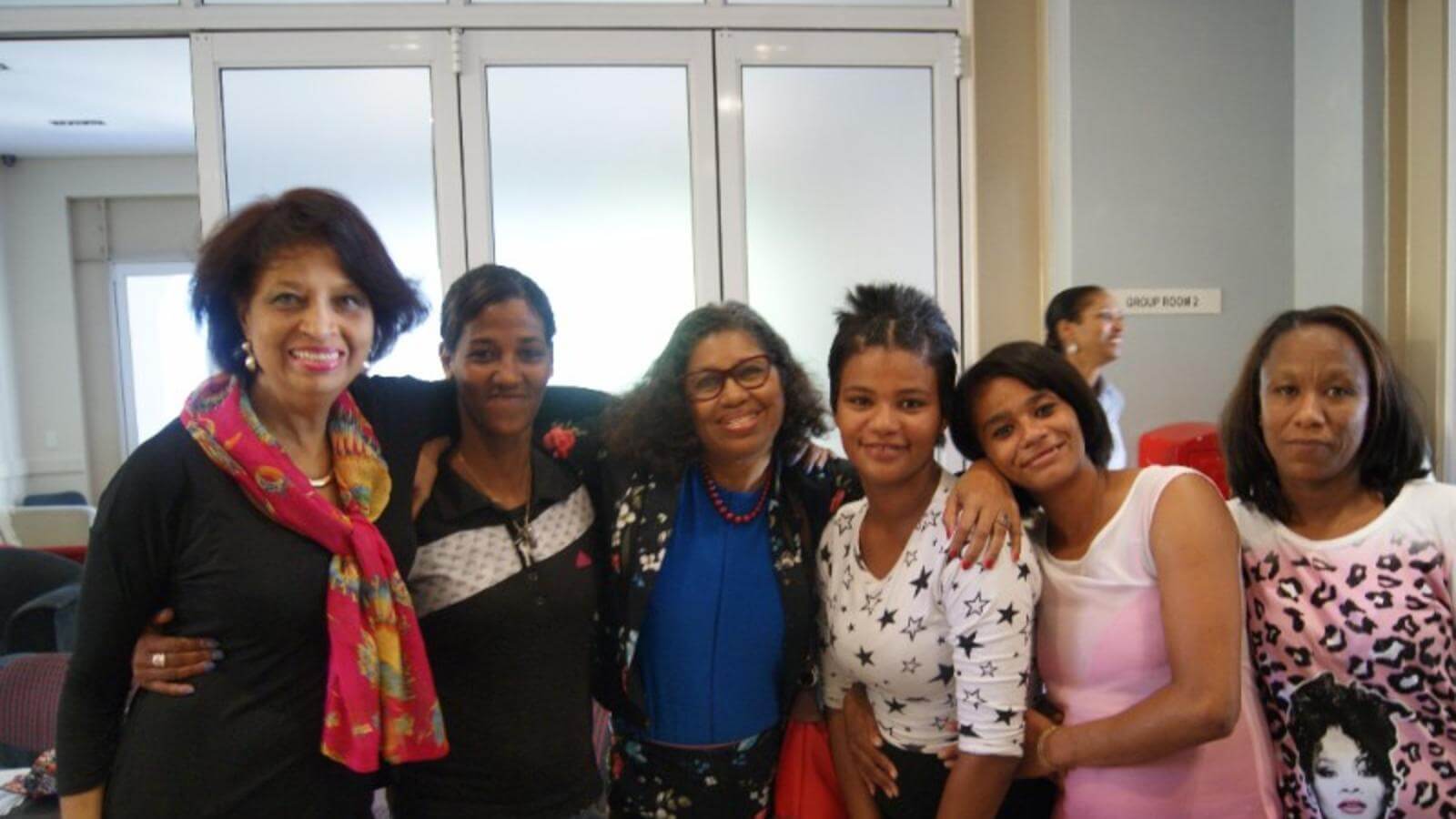 Dean Crewe posing for photo with students