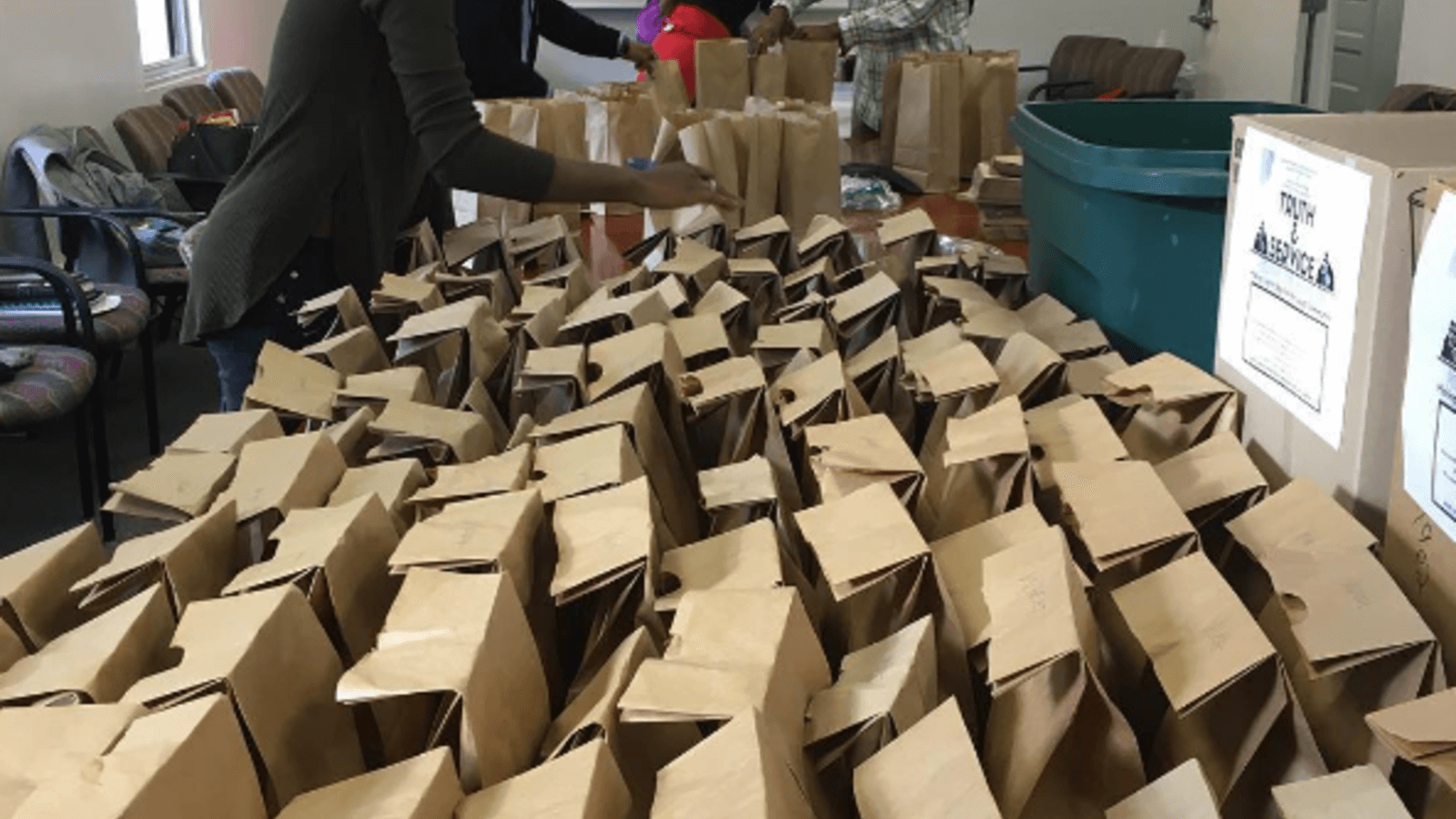 image of a woman organizing packed lunches