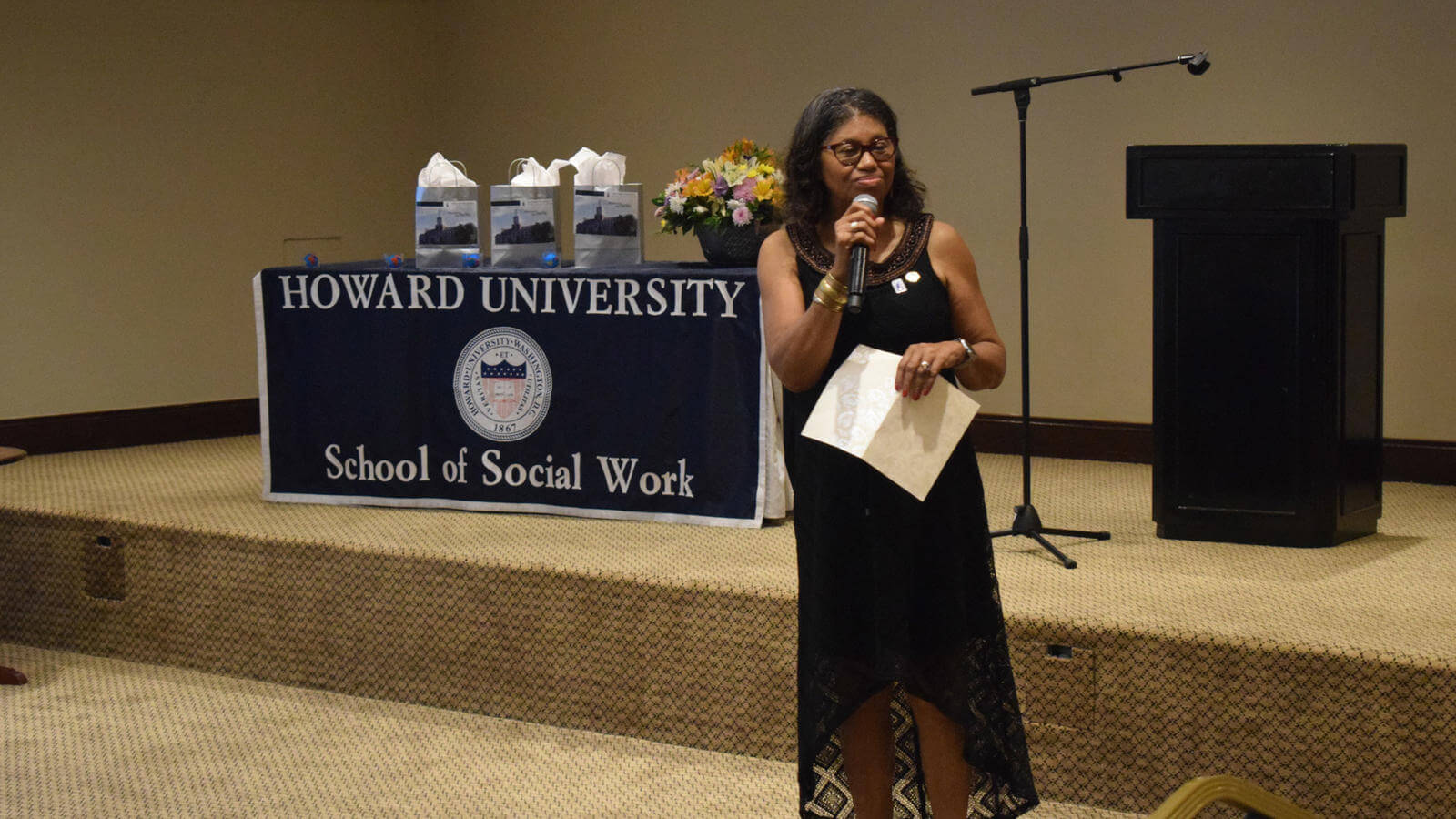 Dean Crewe speaking during ceremony in front of audience
