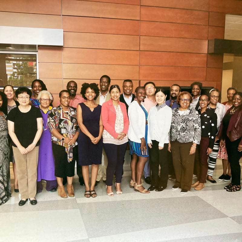 Dr. Gourdine poses in a group of colleagues. 